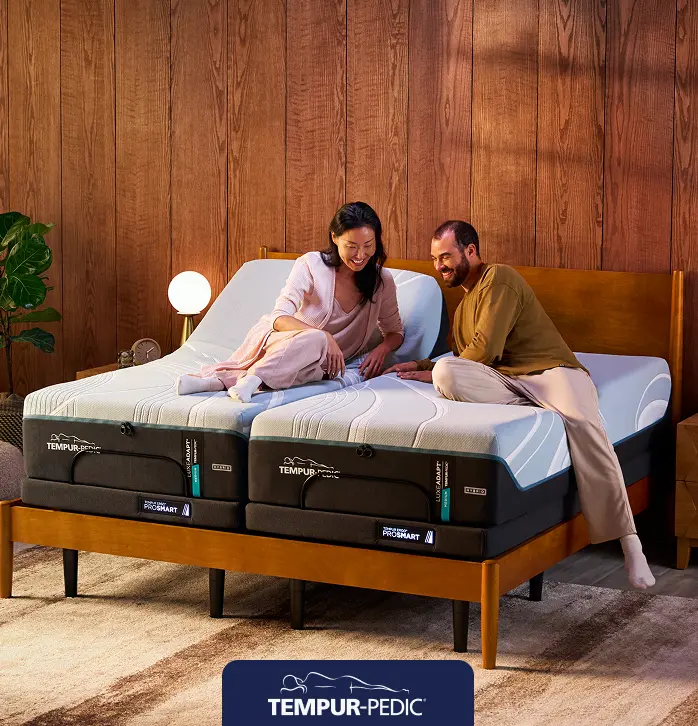 Tempur-Pedic adjustable mattress set displayed in a bright bedroom, highlighting savings of up to $300 instant gift.