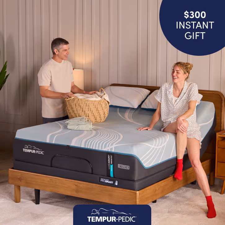 Tempur-Pedic adjustable mattress set displayed in a bright bedroom, highlighting savings of up to $300 instant gift.